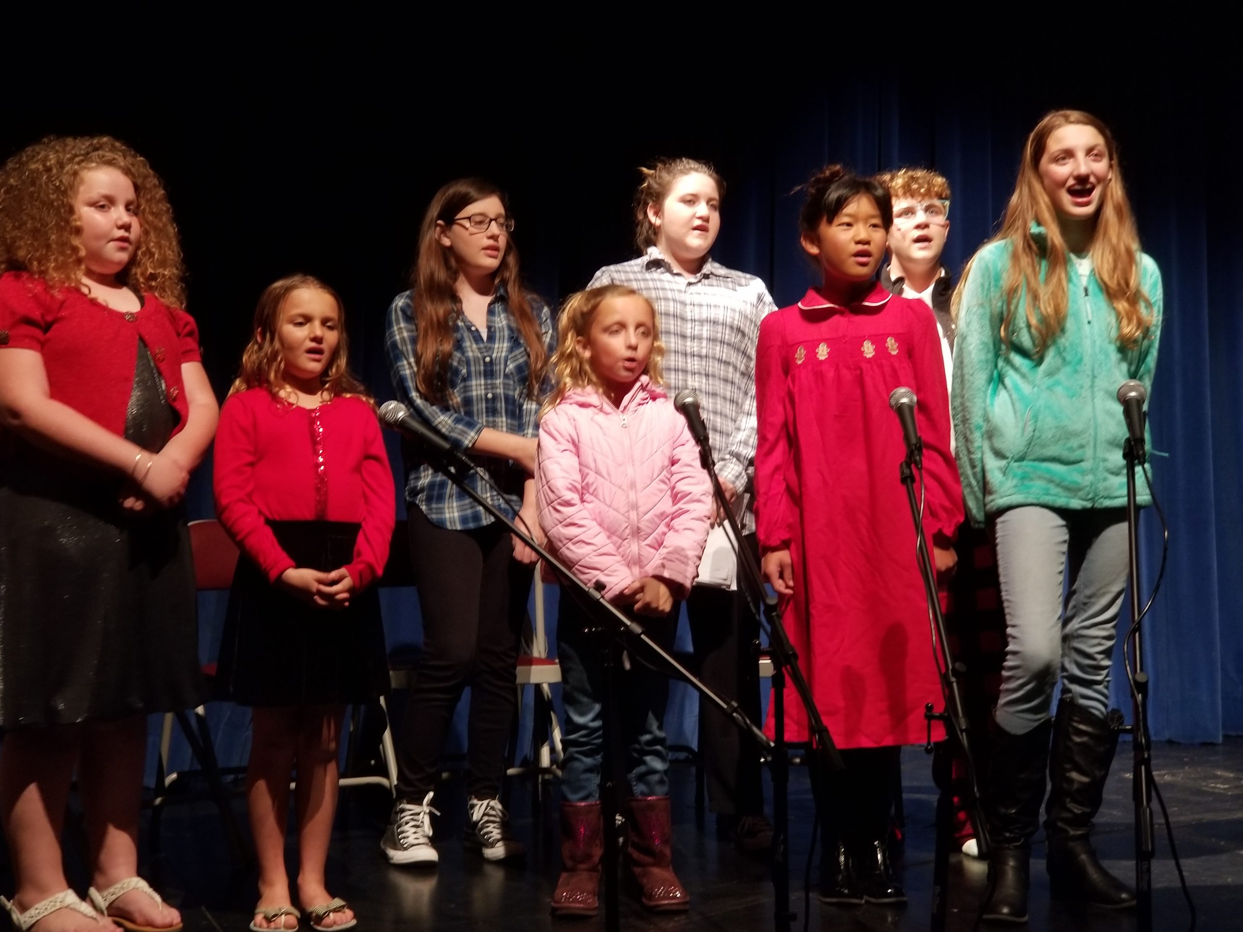 A group of children singing 